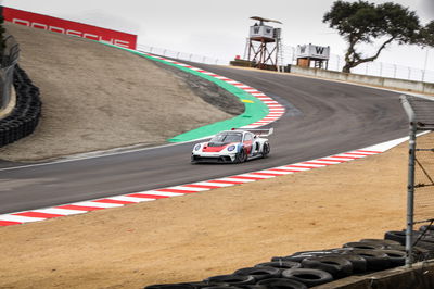 A Porsche 911 GT3 R rennsport tackles Laguna Seca's corkscrew