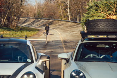 A man walking his dog around the Monza oval